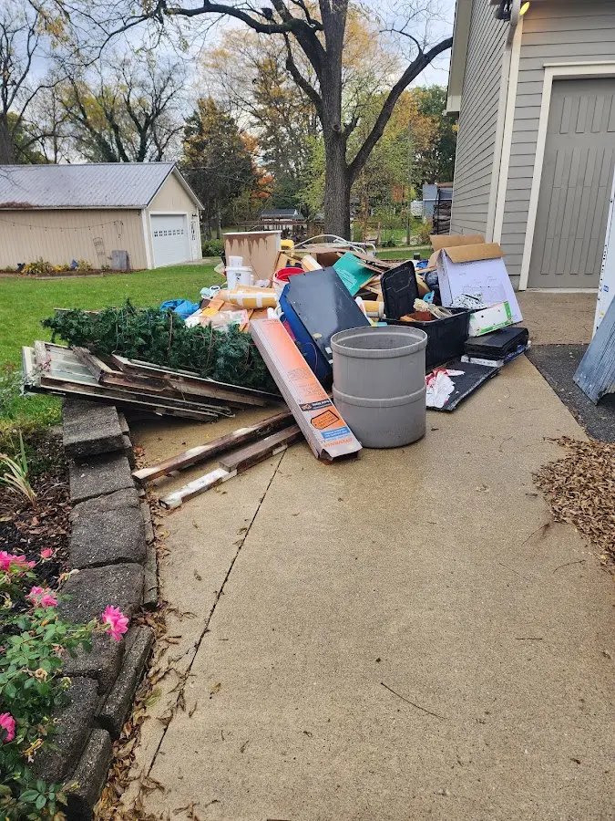 Dumpster being loaded with debris for Residential Dumpster Rental in Portsmouth